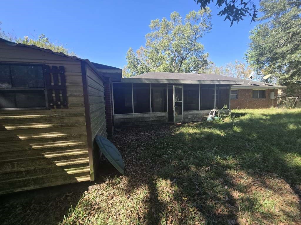 509 Bobcat Lane Daisetta, TX 77533 - Photo 2 of 26 a view of a house with a yard