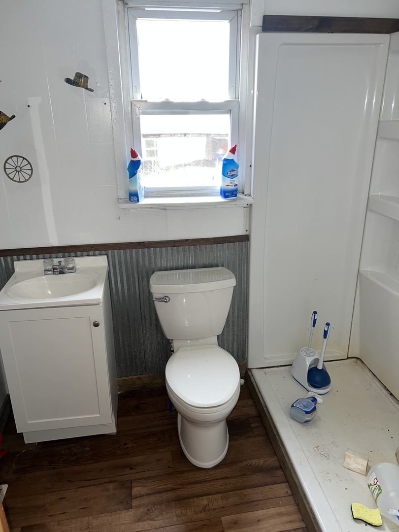 5597 East Boy Scout Road St. Anne, IL 60964 - Photo 11 of 25 a bathroom with a toilet and a sink