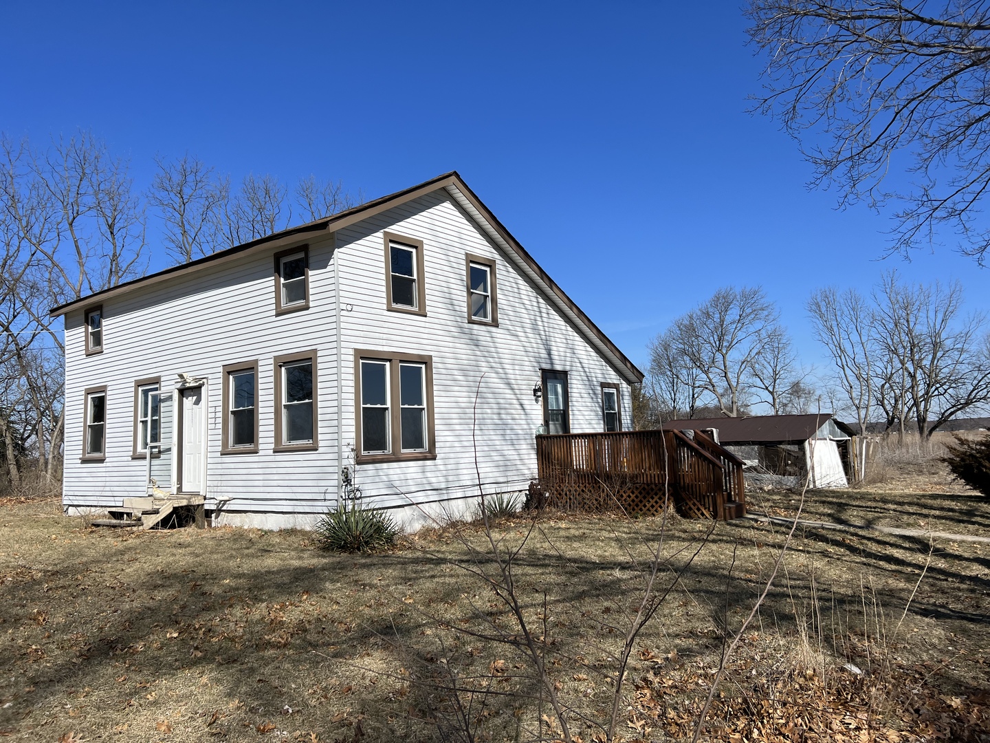 5597 East Boy Scout Road St. Anne, IL 60964 - Photo 3 of 25 a front view of a house with a yard