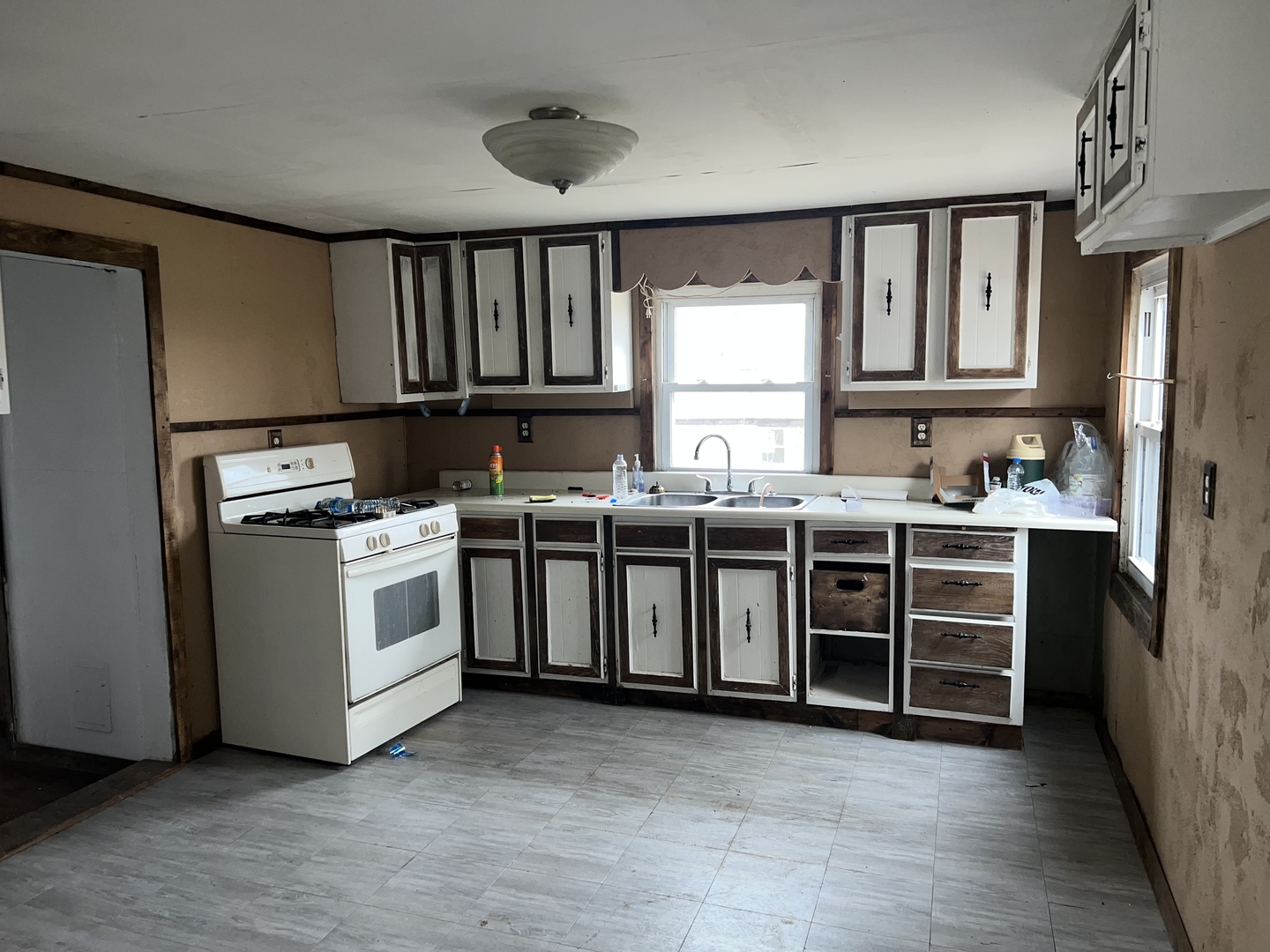 5597 East Boy Scout Road St. Anne, IL 60964 - Photo 6 of 25 a utility room with stainless steel appliances a stove a sink dishwasher a refrigerator and cabinets