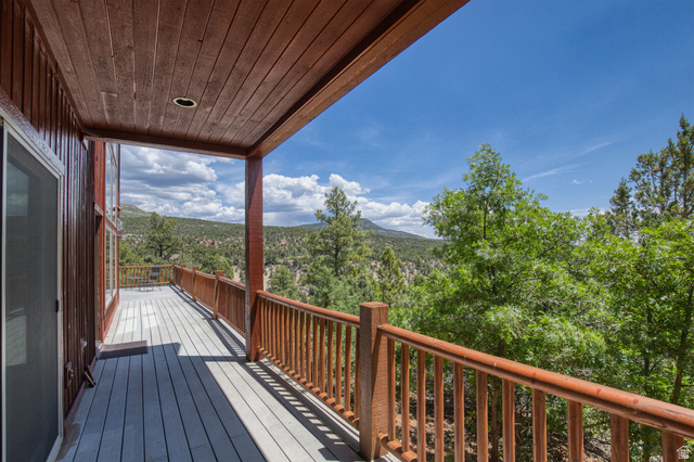 755 South Zion Ridge Drive Orderville, UT 84758 - Photo 19 of 84 Deck with a forest view and a mountain view