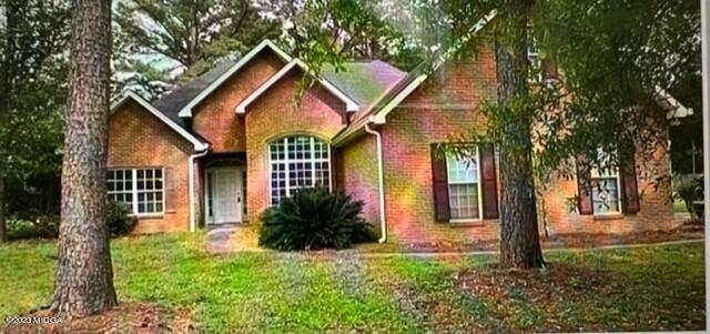 6322 Skipperton Road Macon, GA 31216 - Photo 1 of 1 a front view of a house with garden