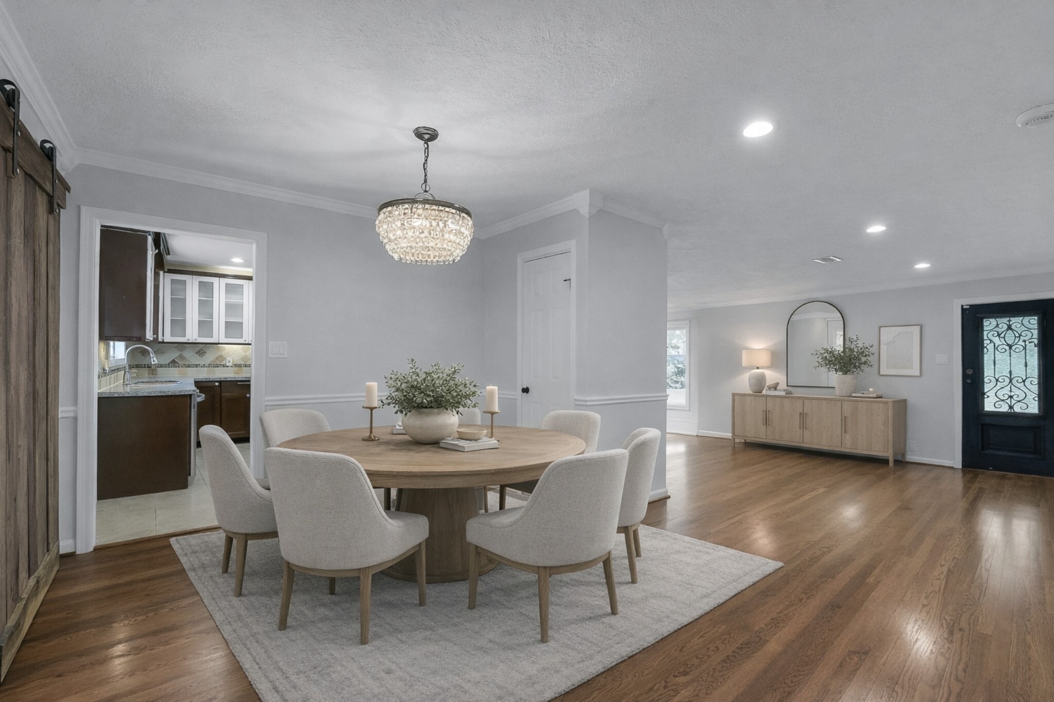 9623 Val Verde Street Houston, TX 77063 - Photo 11 of 26 Dining area ideally positioned between kitchen & sunroom — as virtually staged — creating an inviting setting for gatherings.