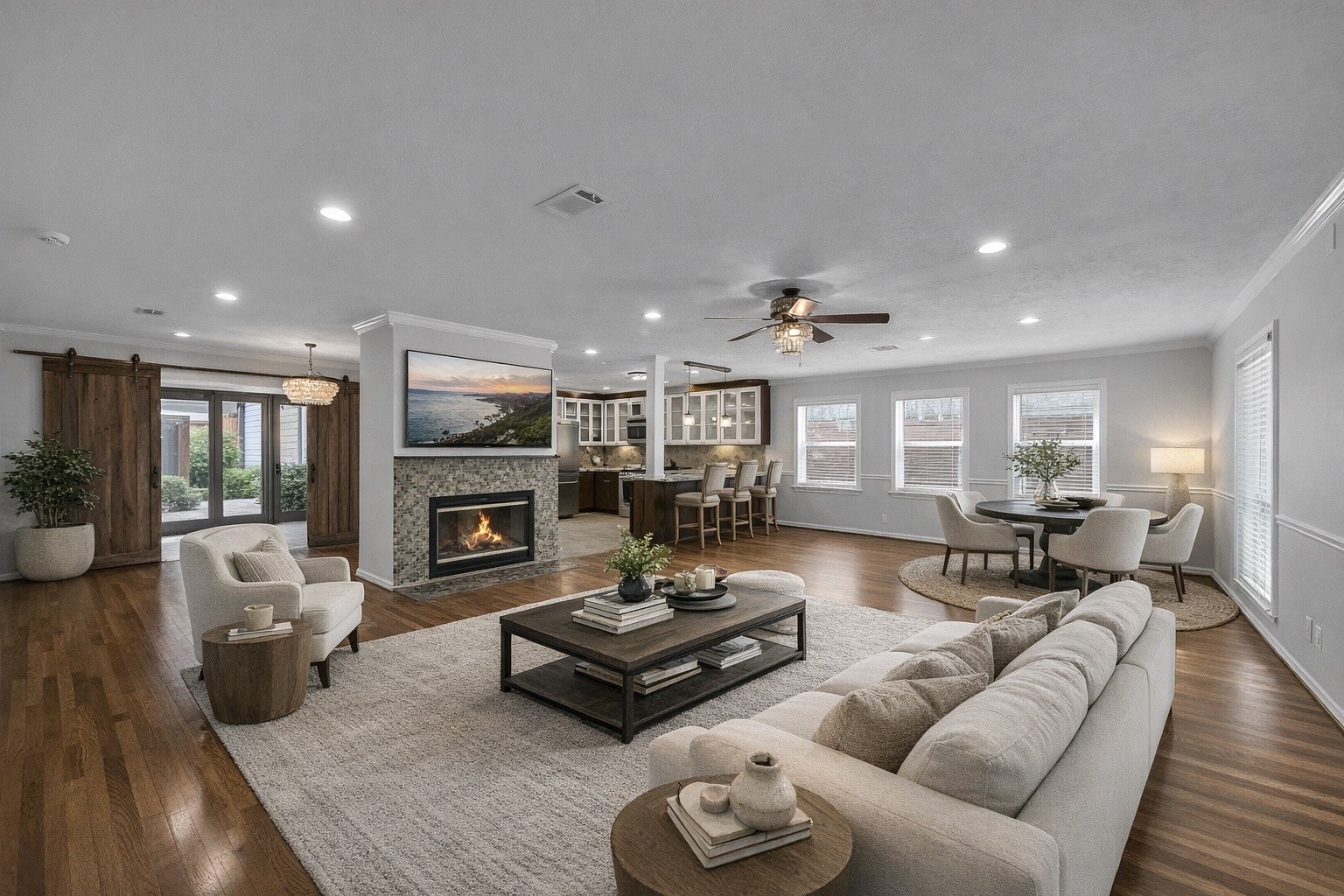 9623 Val Verde Street Houston, TX 77063 - Photo 26 of 26 Spacious living area offers flexibility for additional seating or a breakfast table just off the kitchen — as virtually staged — highlighting the functional flow & versatility of the open floor plan. Large windows flood this space w/natural light.