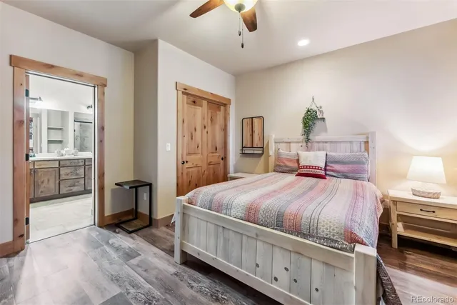 a bed room with a bed and a chandelier