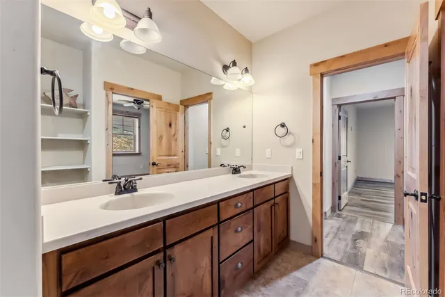 a bathroom with a sink double vanity and a mirror