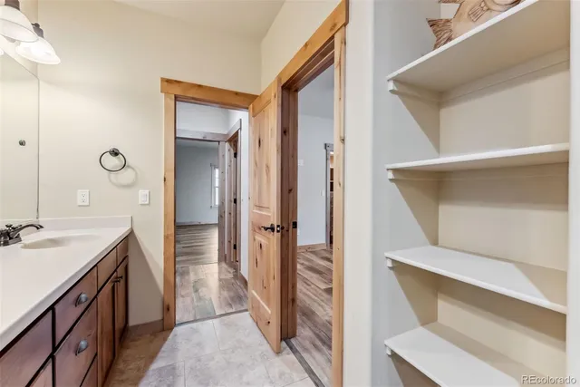 a bathroom with a sink and mirror
