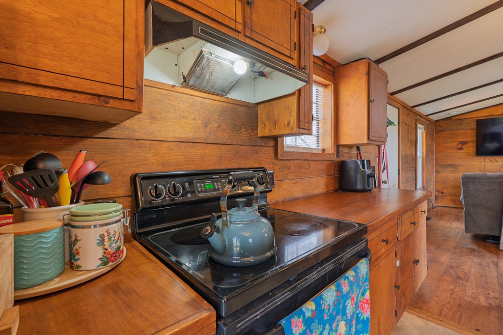 92 Mountain View Drive Jasper, GA 30143 - Photo 11 of 20 a kitchen with stainless steel appliances granite countertop a stove a sink and a microwave
