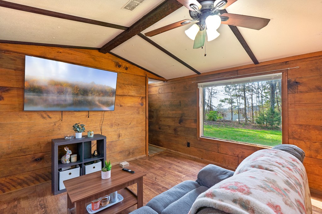 92 Mountain View Drive Jasper, GA 30143 - Photo 13 of 20 a living room with furniture and a floor to ceiling window