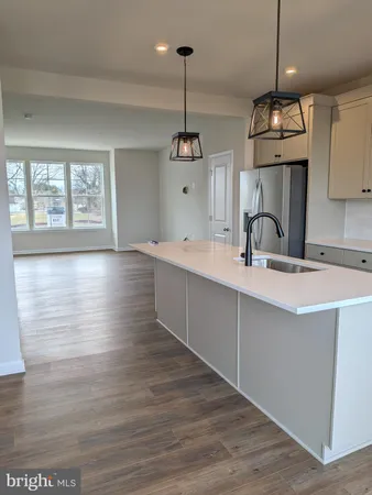 a kitchen with sink and window