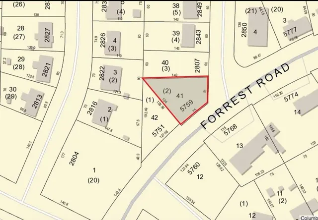 view of a white refrigerator with white walls