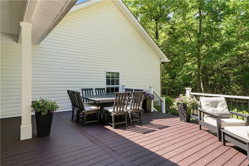 310 Gaines Road Southeast Dalton, GA 30721 - Photo 40 of 53 a view of a roof deck with table and chairs
