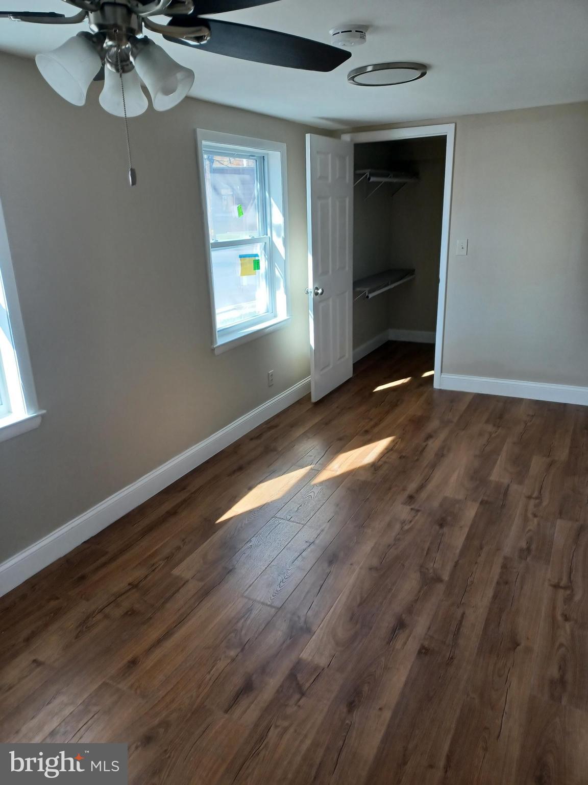 43 Durham Road Penndel, PA 19047 - Photo 3 of 5 a view of an empty room with a window and wooden floor