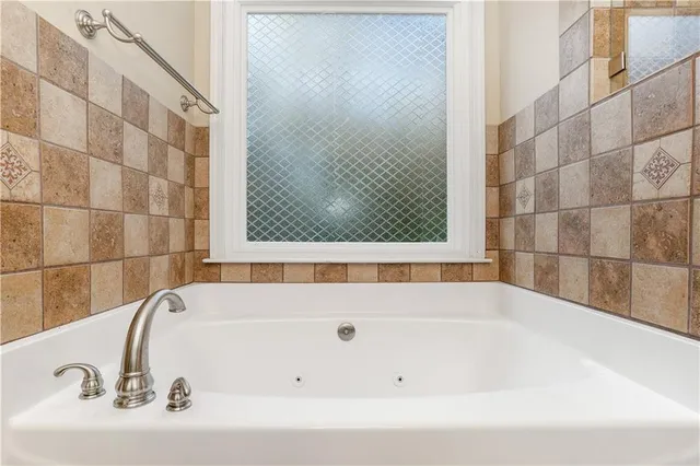 a bathroom with a bathtub and a sink