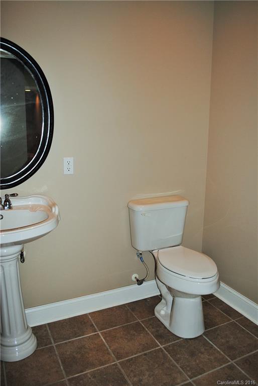 975 Jackson Road Salisbury, NC 28146 - Photo 11 of 24 a bathroom with a toilet a sink and a mirror
