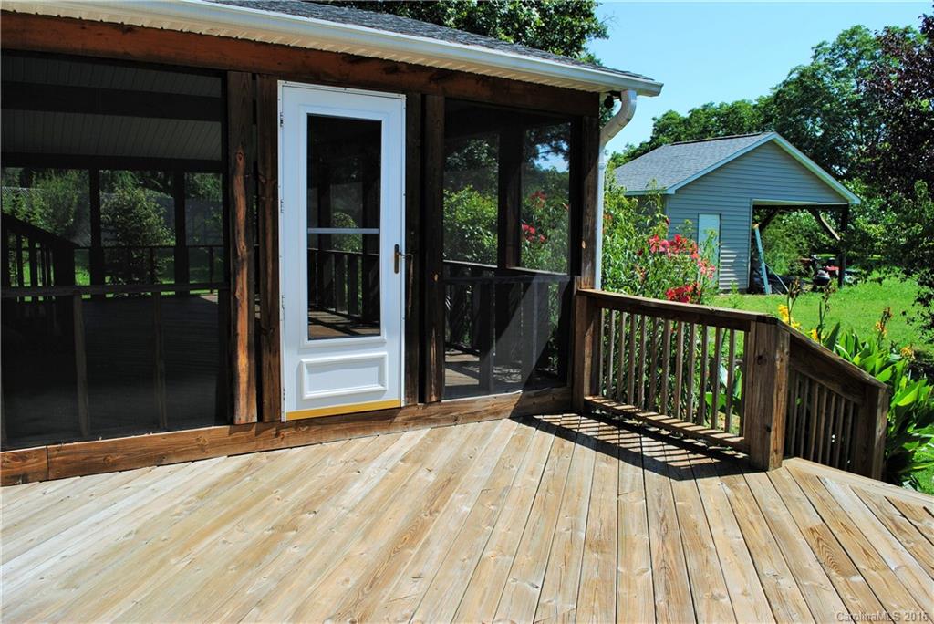 975 Jackson Road Salisbury, NC 28146 - Photo 19 of 24 a view of backyard with a deck and wooden floor