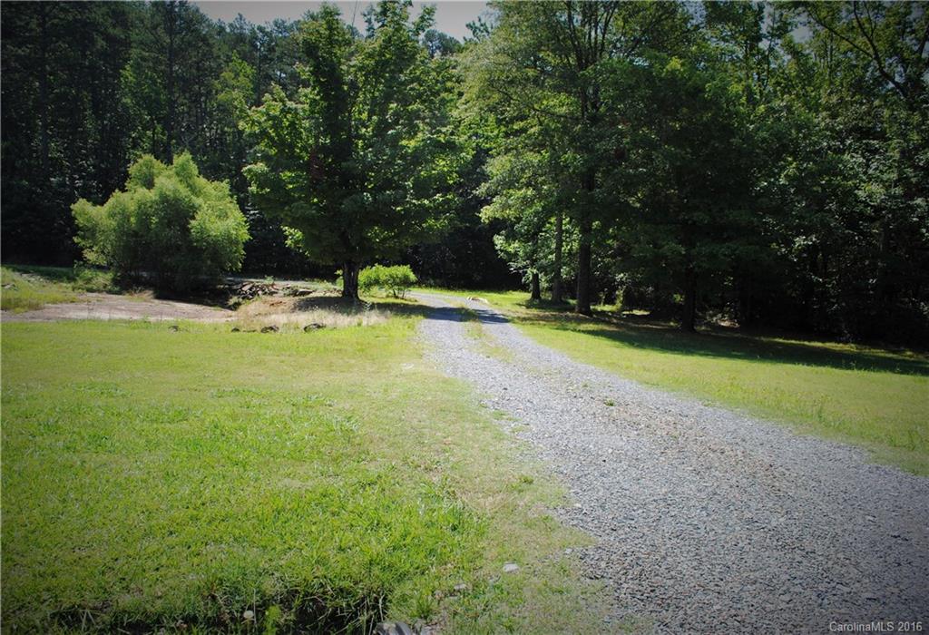 975 Jackson Road Salisbury, NC 28146 - Photo 20 of 24 a view of a swimming pool and trees in the background