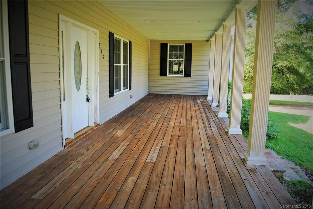 975 Jackson Road Salisbury, NC 28146 - Photo 3 of 24 a view of wooden floor in a backyard of a house