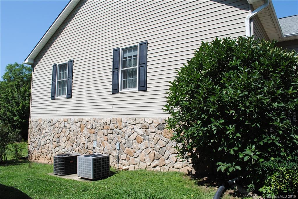 975 Jackson Road Salisbury, NC 28146 - Photo 22 of 24 a view of a house with a yard and garage