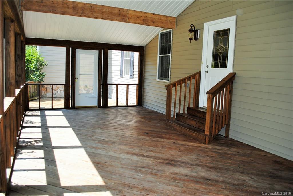 975 Jackson Road Salisbury, NC 28146 - Photo 4 of 24 a view of a balcony with wooden floor and furniture