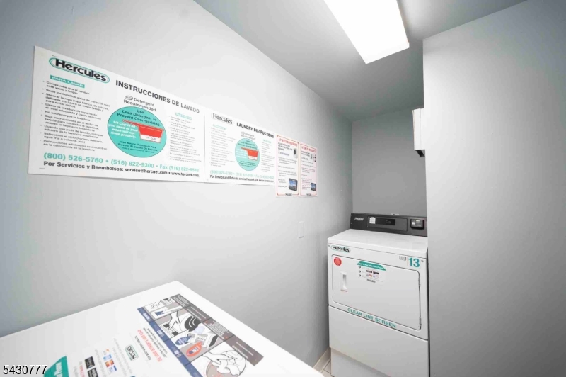 115 Polifly Road, Unit 5D Hackensack, NJ 07601 - Photo 8 of 10 a utility room with dryer and washer