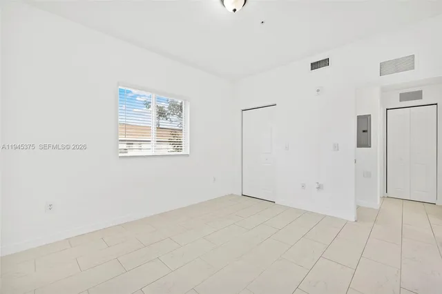 a view of an empty room with a window