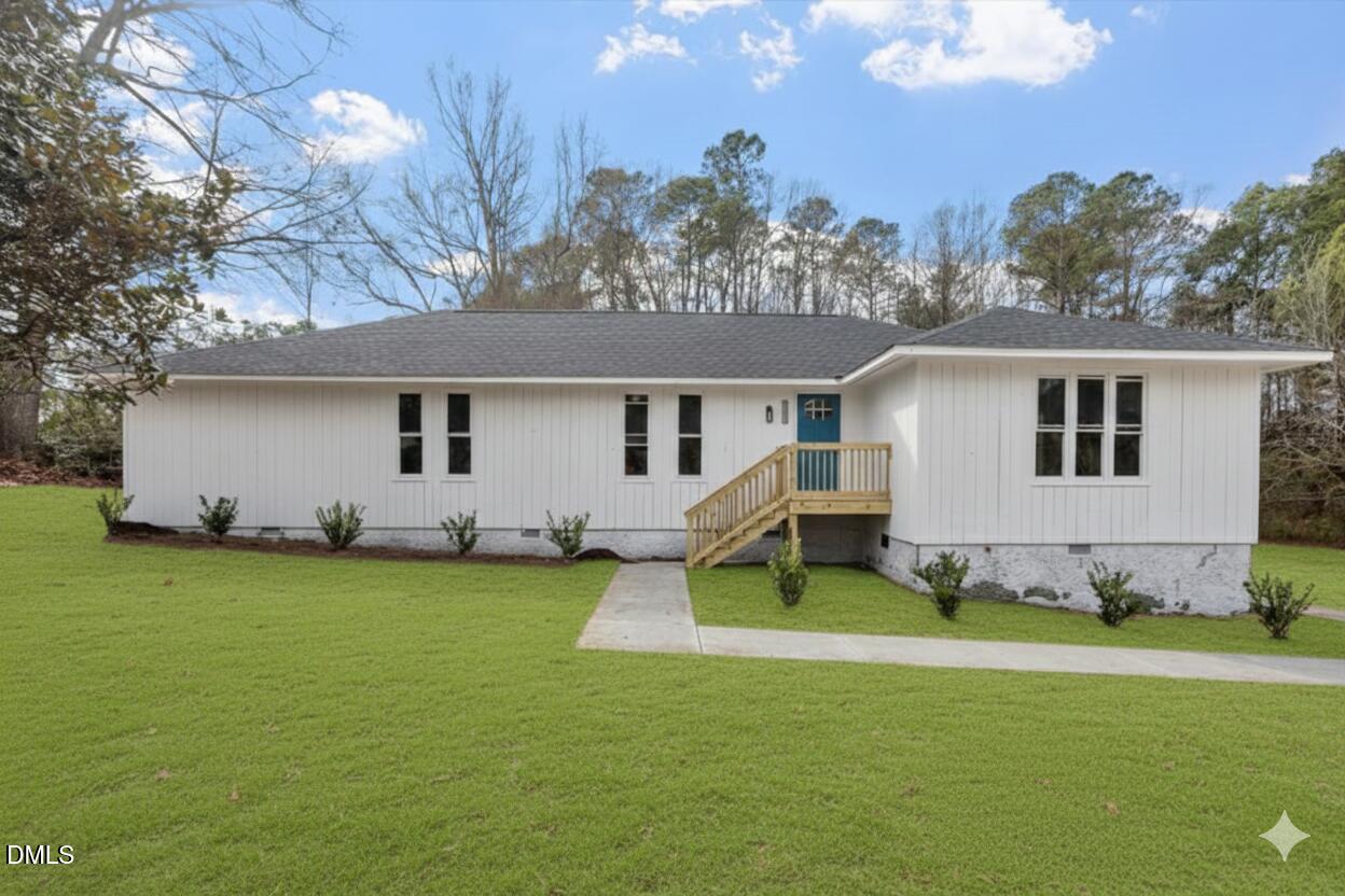 7589 Bray Road Bailey, NC 27807 - Photo 1 of 23 a backyard of a house with table and chairs