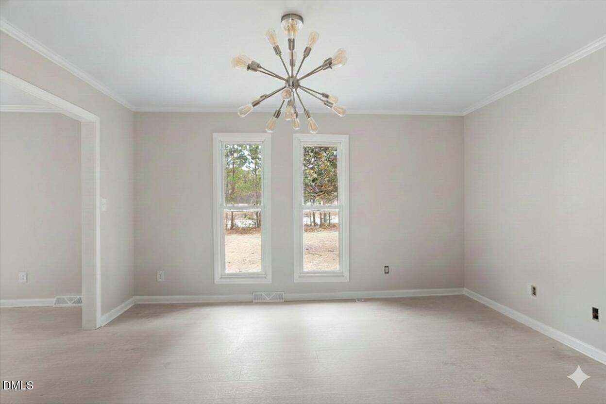 7589 Bray Road Bailey, NC 27807 - Photo 7 of 23 wooden floor in an empty room with a window