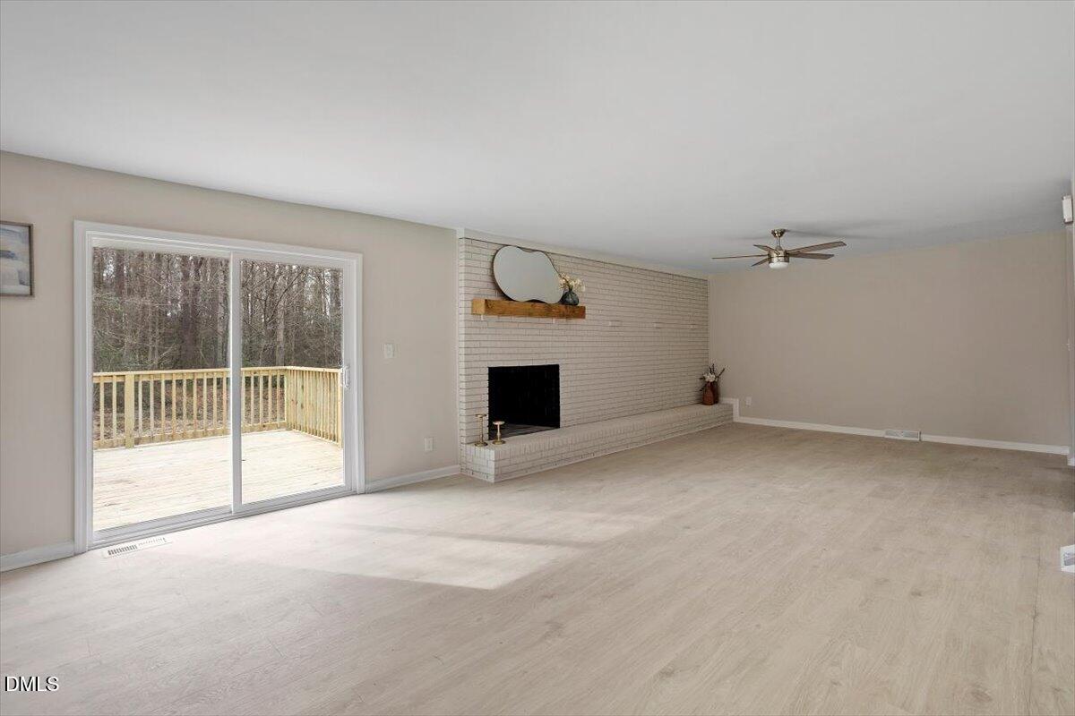 7589 Bray Road Bailey, NC 27807 - Photo 8 of 23 a view of empty room with a fireplace