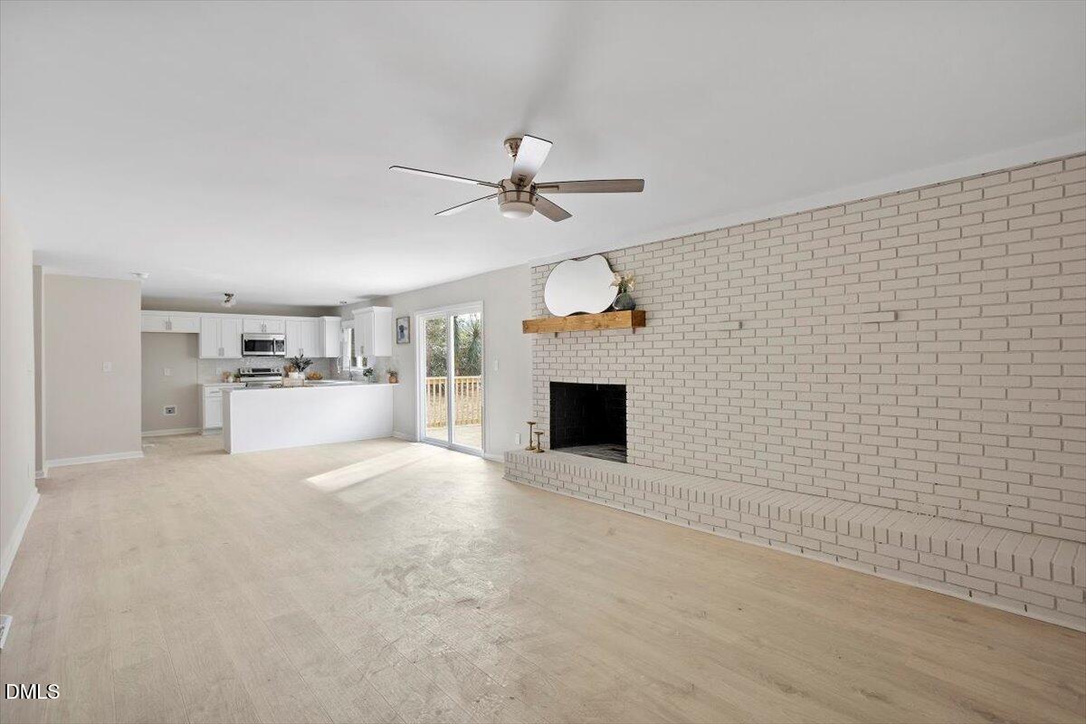 7589 Bray Road Bailey, NC 27807 - Photo 10 of 23 a view of empty room with a fireplace and window