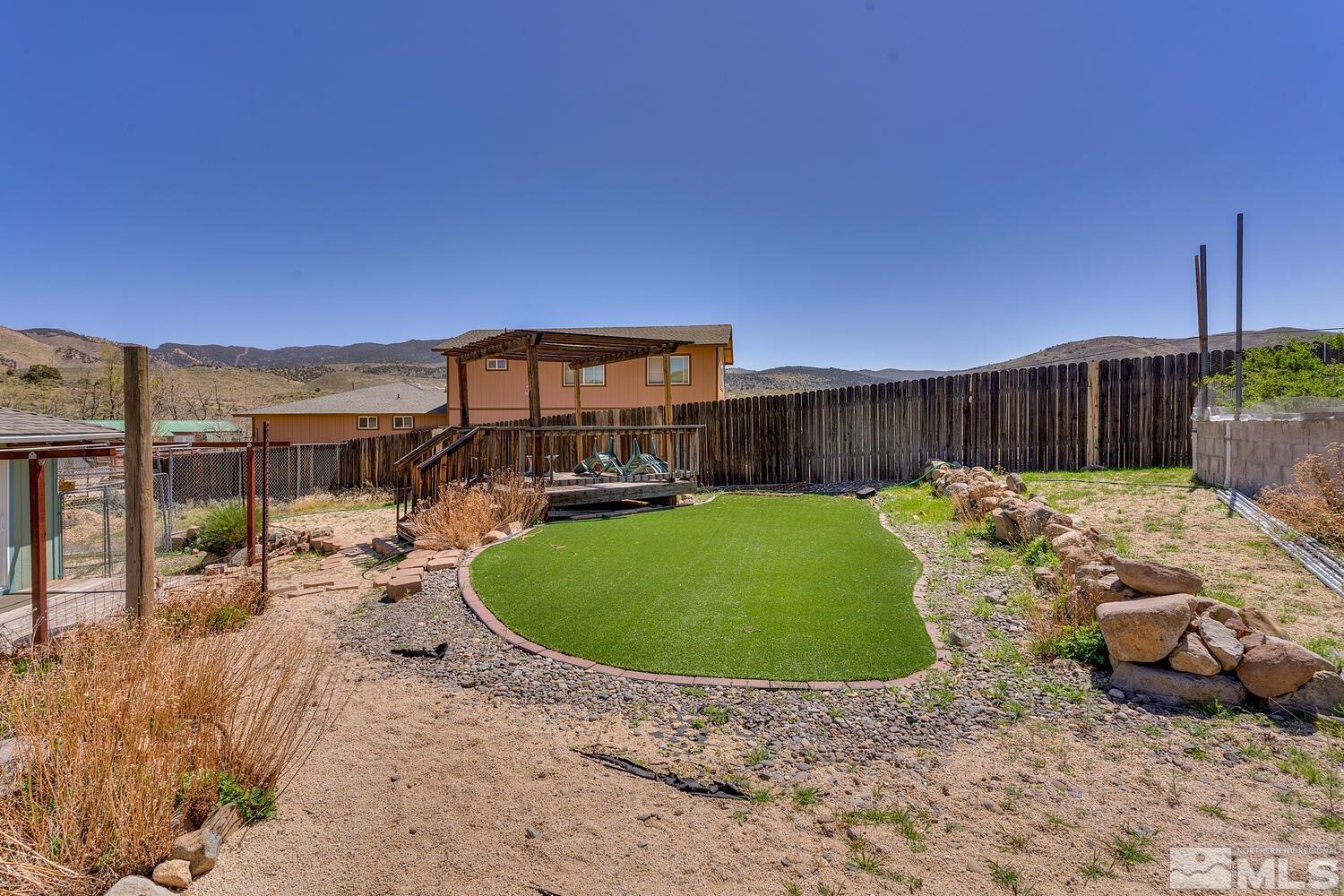 16015 Rocky Vista Road Reno, NV 89521 - Photo 17 of 20 a view of a backyard with plants and a patio