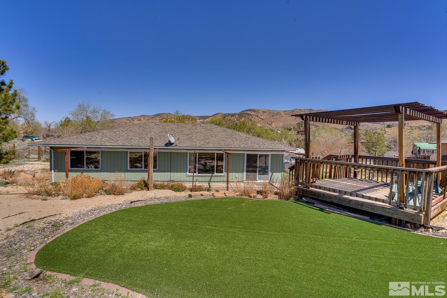 16015 Rocky Vista Road Reno, NV 89521 - Photo 20 of 20 a view of a house with a backyard porch and sitting area
