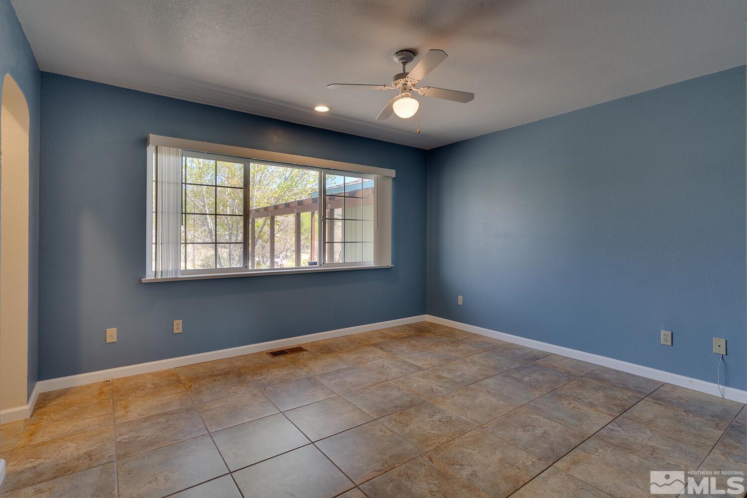 16015 Rocky Vista Road Reno, NV 89521 - Photo 9 of 20 a view of an empty room with a window