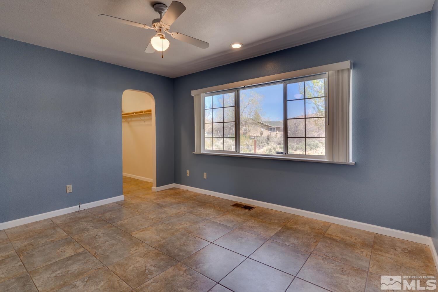 16015 Rocky Vista Road Reno, NV 89521 - Photo 10 of 20 a view of an empty room with a window