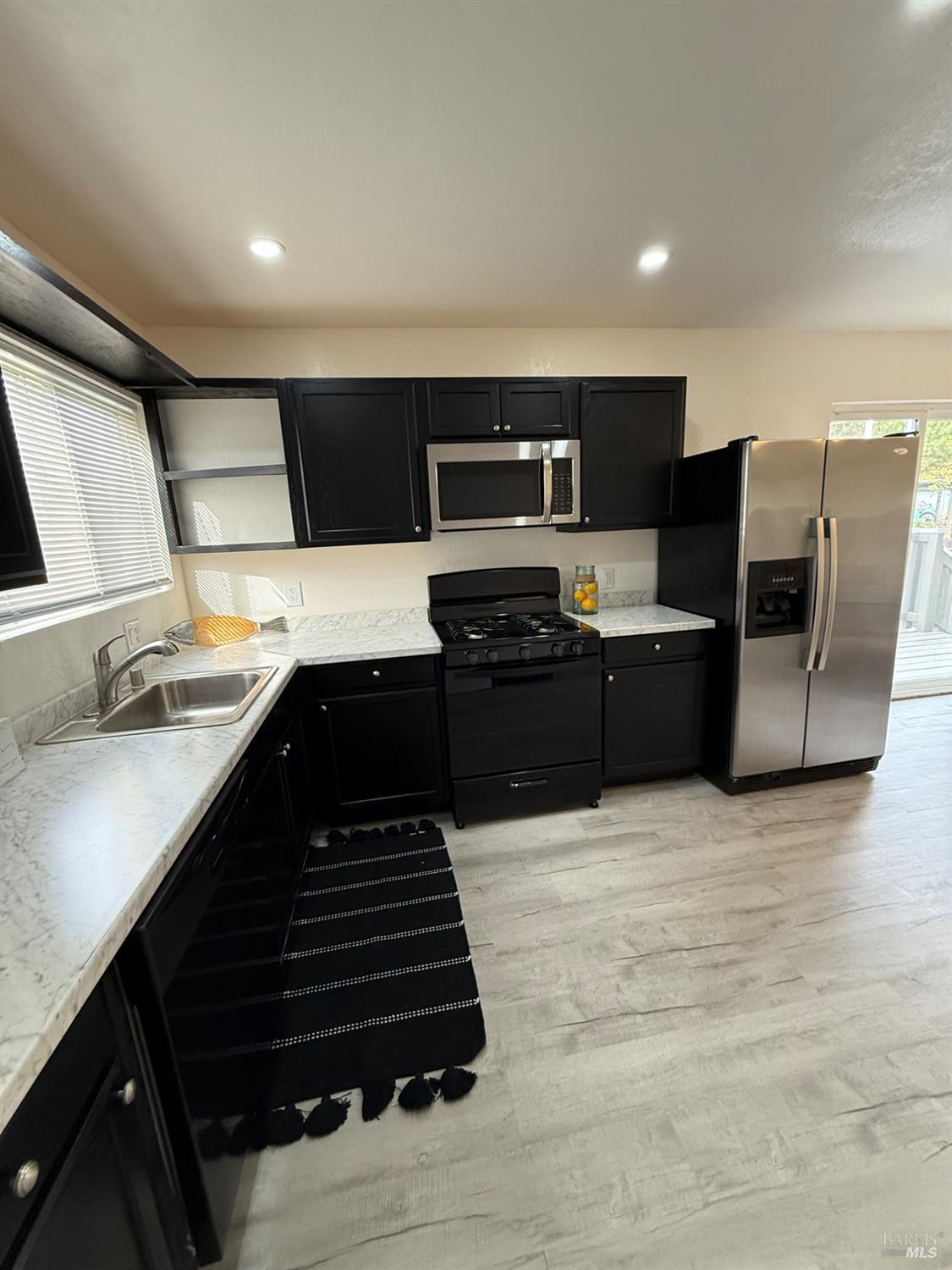 219 Florida Street Vallejo, CA 94590 - Photo 6 of 58 Unit A Updated kitchen with stainless steel appliances and ample counter space.