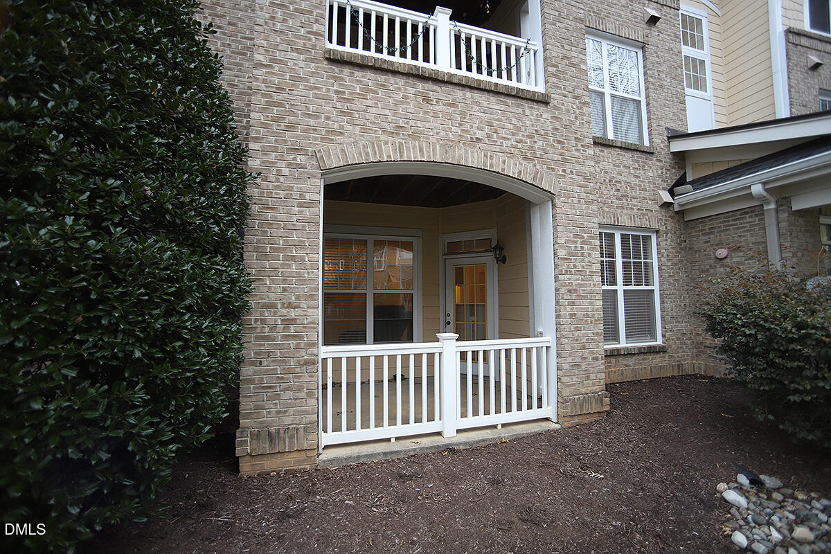 3161 Hemlock Forest Circle, Unit 101 Raleigh, NC 27612 - Photo 3 of 21 front view of a house with a porch