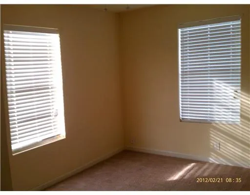 a view of an empty room and a window