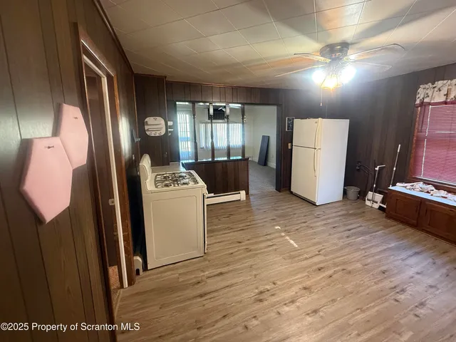 a room with refrigerator and washer