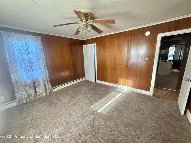 a view of an empty room with a mirror