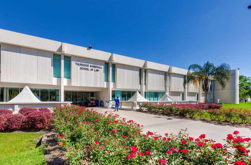 6202 Conley Street Houston, TX 77021 - Photo 6 of 7 a front view of a building with flower garden and trees
