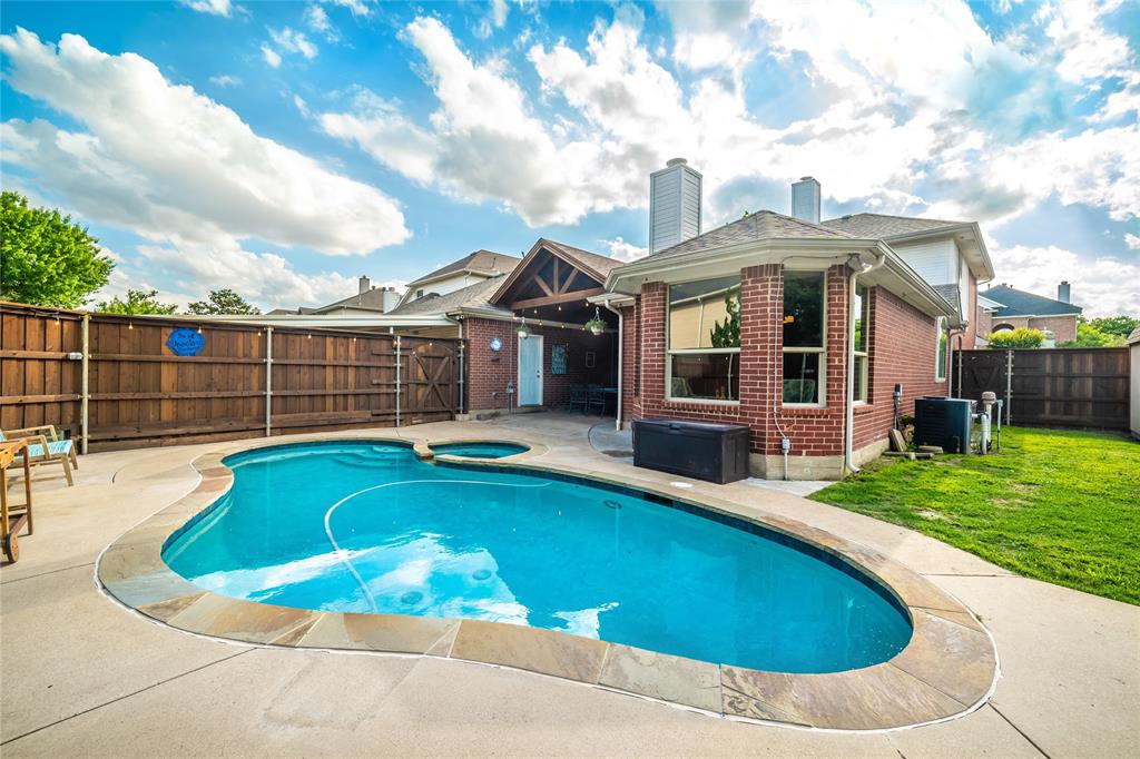 7612 Trevino Drive Plano, TX 75025 - Photo 1 of 40 a view of a house with swimming pool and porch