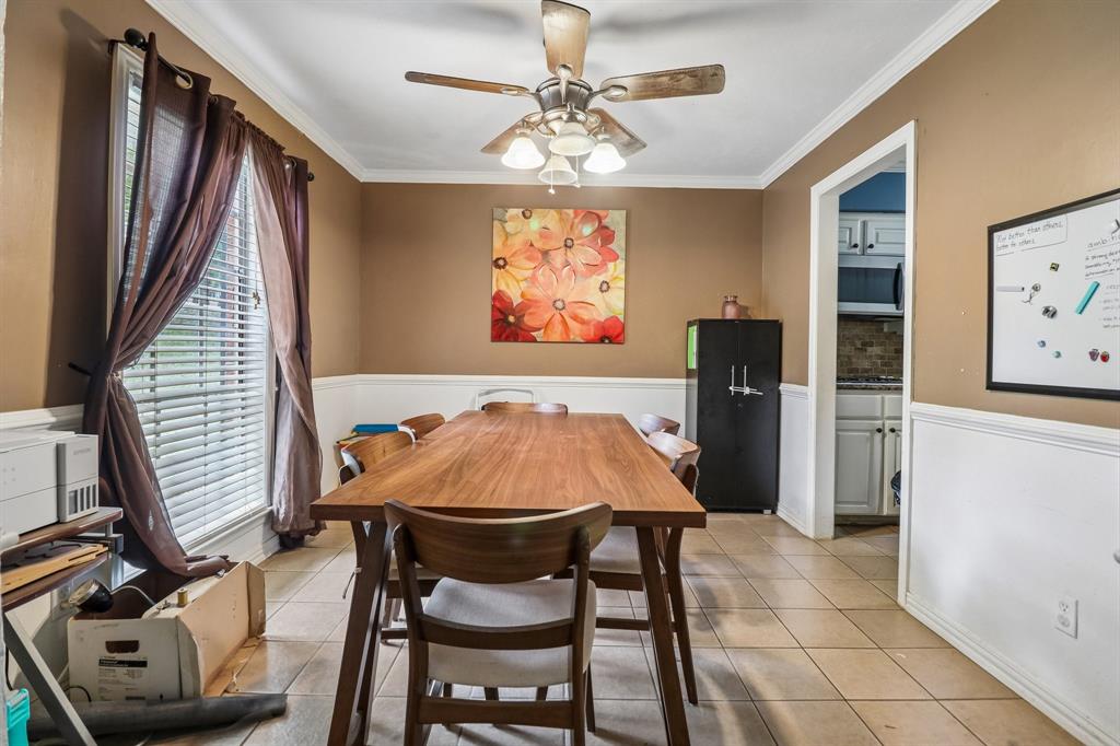 820 North Bowen Road Arlington, TX 76012 - Photo 14 of 40 a view of a dining room with furniture and chandelier