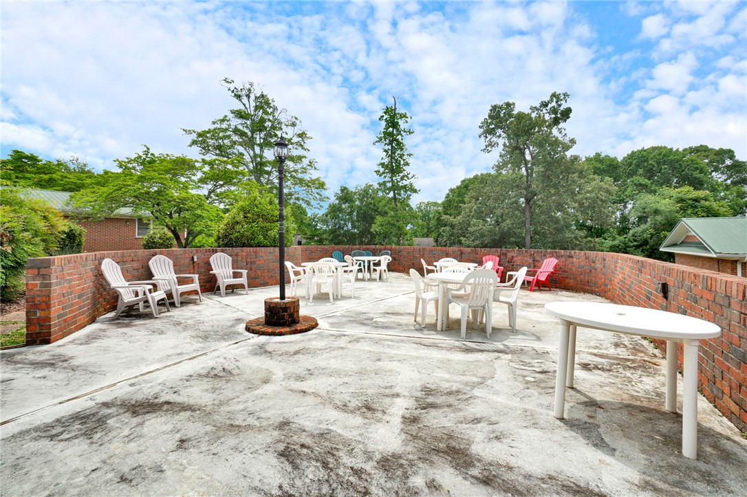 104 Captains Way Anderson, SC 29625 - Photo 24 of 47 This spacious outdoor patio offers ample room for gatherings and relaxation.