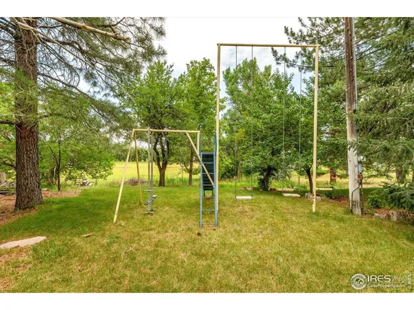 a backyard of apartments with large trees