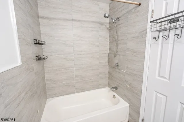 a bathroom with a white bath tub