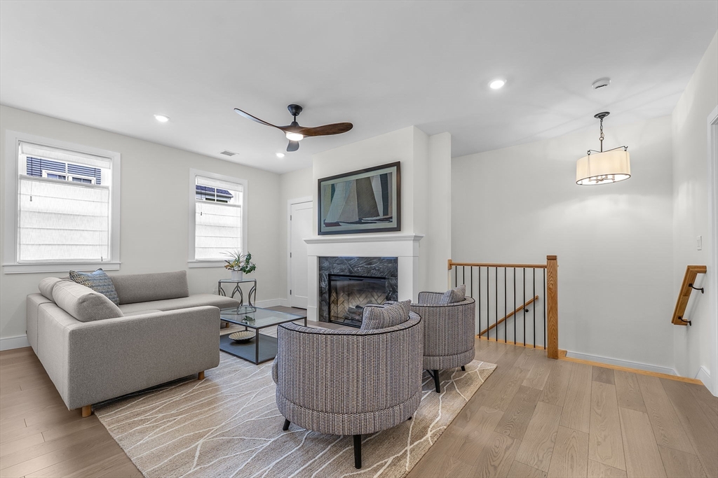 28 Oxbow Road, Unit 142 Raynham, MA 02767 - Photo 15 of 42 a living room with furniture and a fireplace