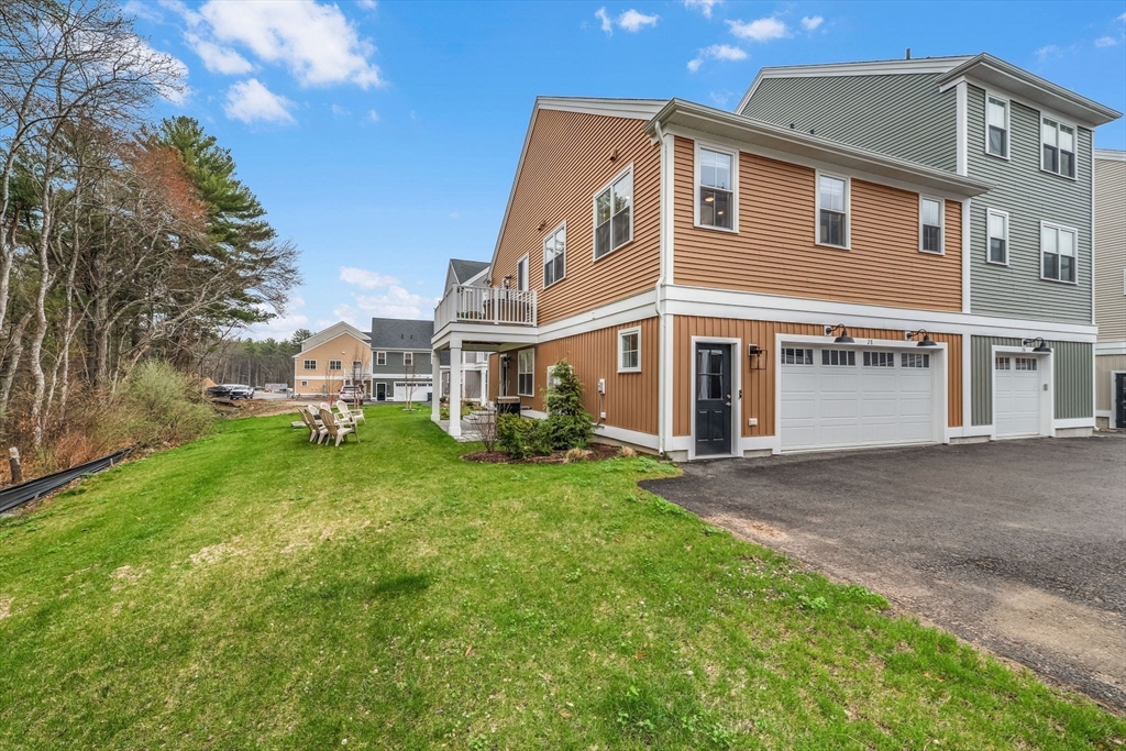 28 Oxbow Road, Unit 142 Raynham, MA 02767 - Photo 2 of 42 a view of a house with a yard