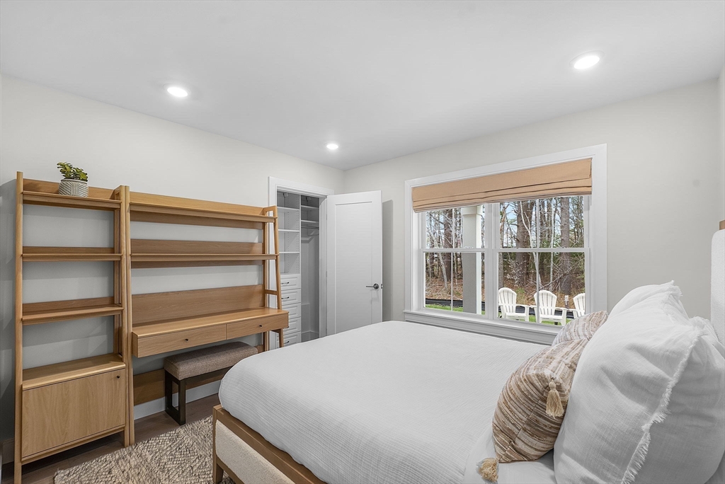 28 Oxbow Road, Unit 142 Raynham, MA 02767 - Photo 29 of 42 a bedroom with a bed and a large window