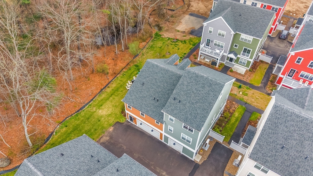 28 Oxbow Road, Unit 142 Raynham, MA 02767 - Photo 3 of 42 an aerial view of a house with a garden and swimming pool
