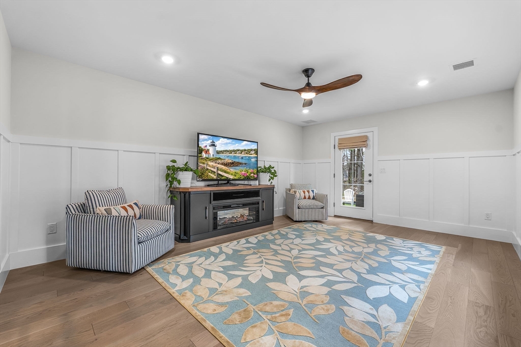 28 Oxbow Road, Unit 142 Raynham, MA 02767 - Photo 33 of 42 a living room with furniture and a flat screen tv